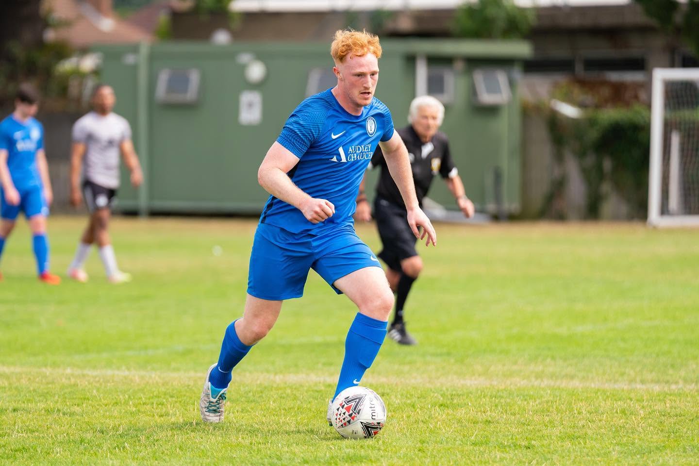 New Elm player in blue during pre-season